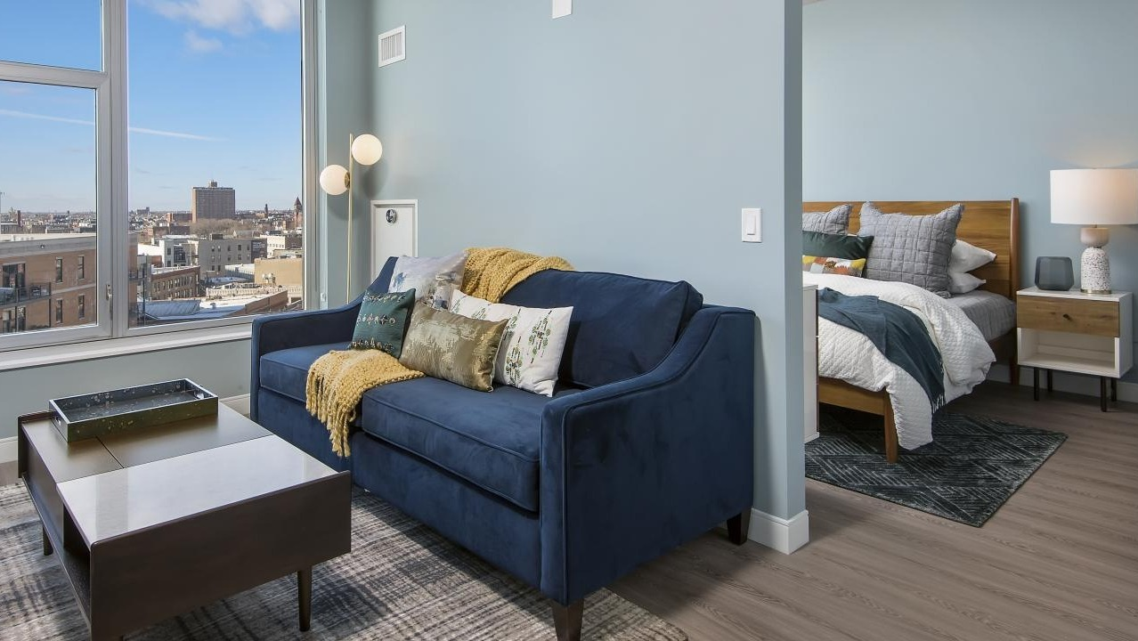 A cozy one-bedroom apartment at Spoke in Chicago, featuring a comfortable living room and bright natural light