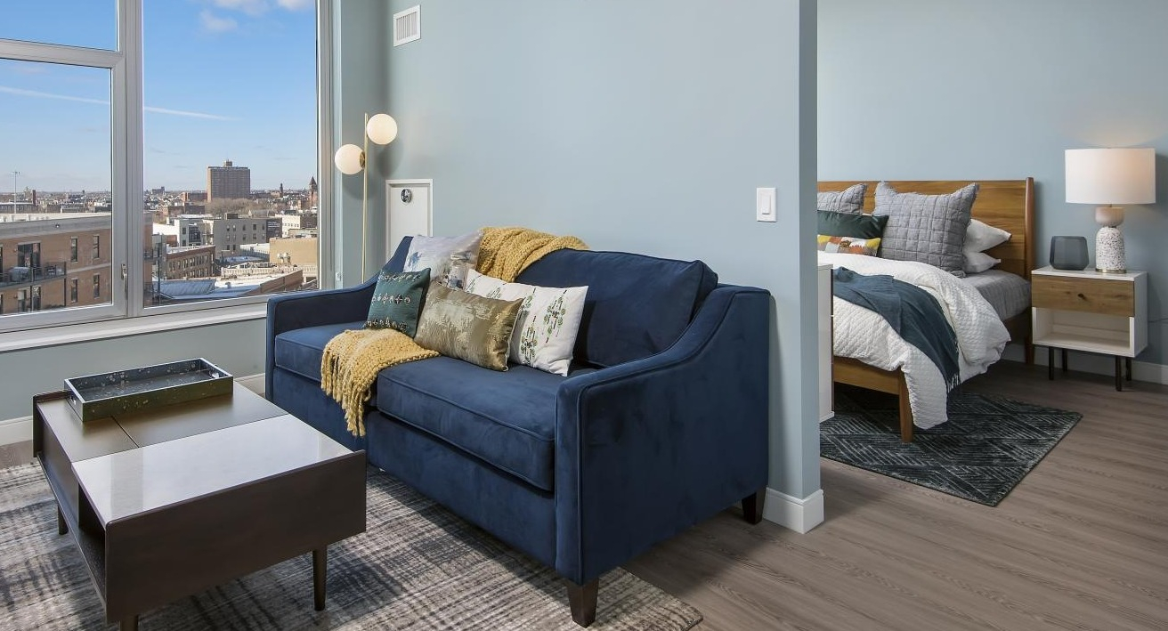A cozy one-bedroom apartment at Spoke in Chicago, featuring a comfortable living room and bright natural light