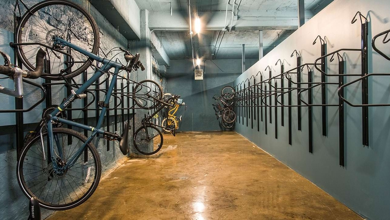 Secure bike storage room at The Alfred Apartments in Chicago, offering multiple racks for residents' bicycles