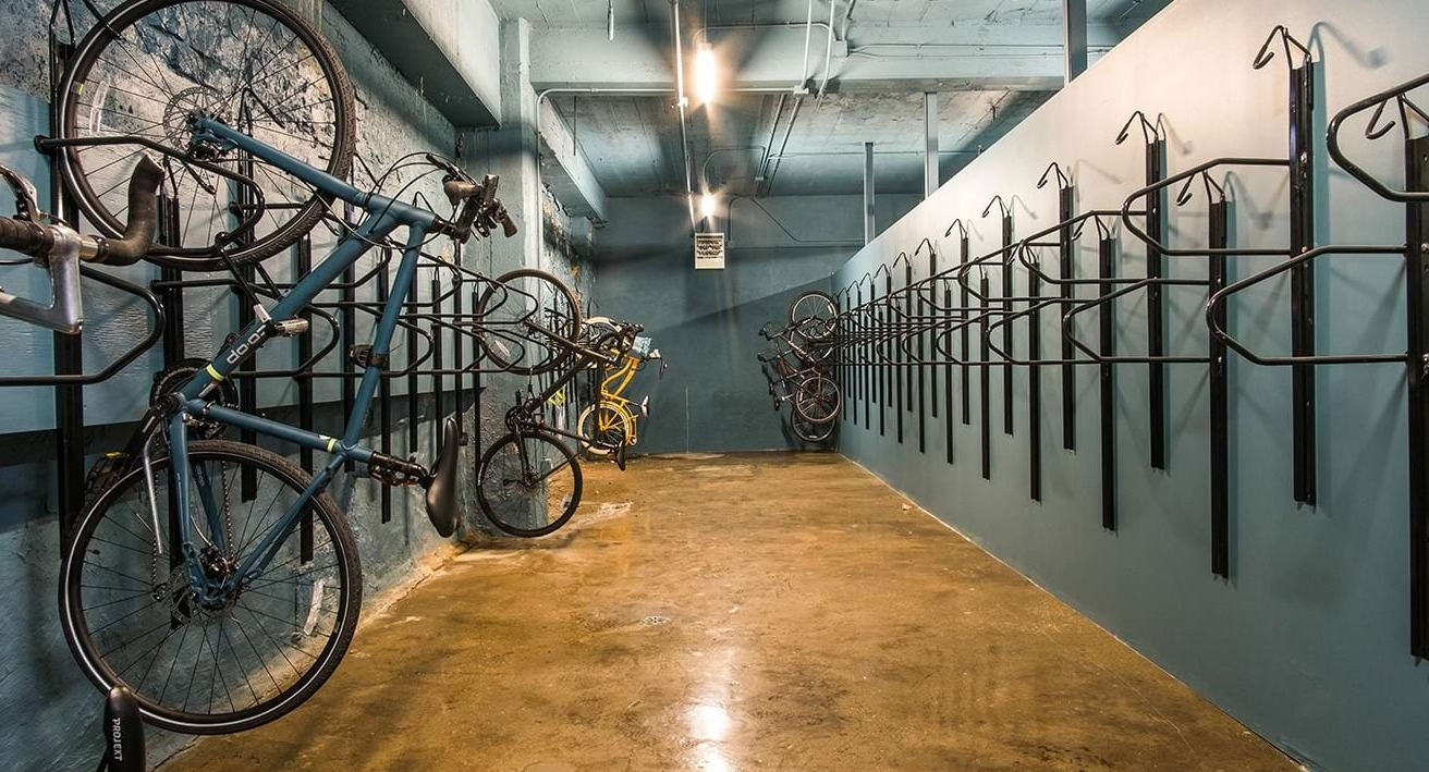 Secure bike storage room at The Alfred Apartments in Chicago, offering multiple racks for residents' bicycles