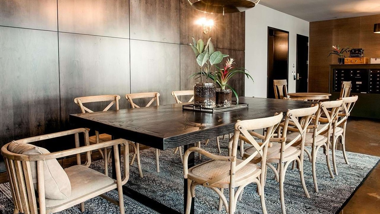 Elegant private dining room at The Ardus in Chicago, featuring a large communal table, stylish lighting, and a refined ambiance