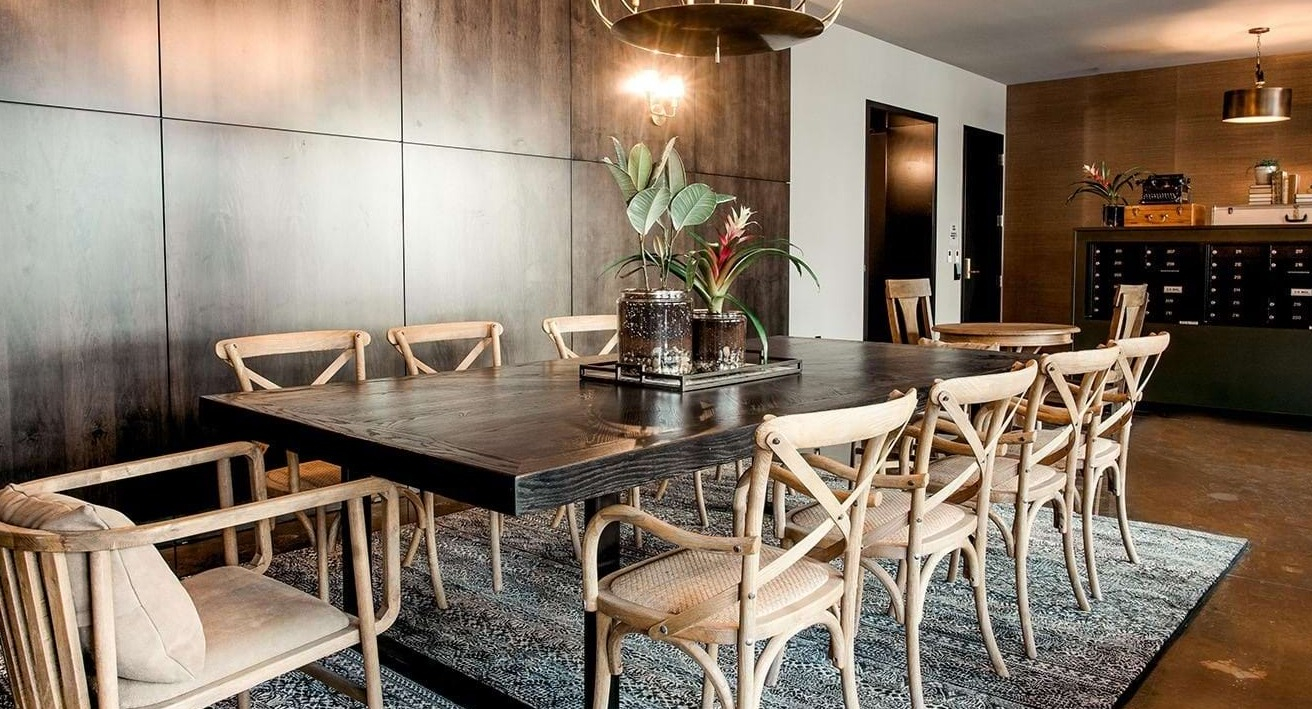 Elegant private dining room at The Ardus in Chicago, featuring a large communal table, stylish lighting, and a refined ambiance