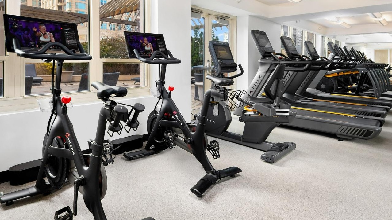 State-of-the-art fitness center with Peloton bikes, treadmills, and various cardio equipment at The Bernardin Apartments in Chicago