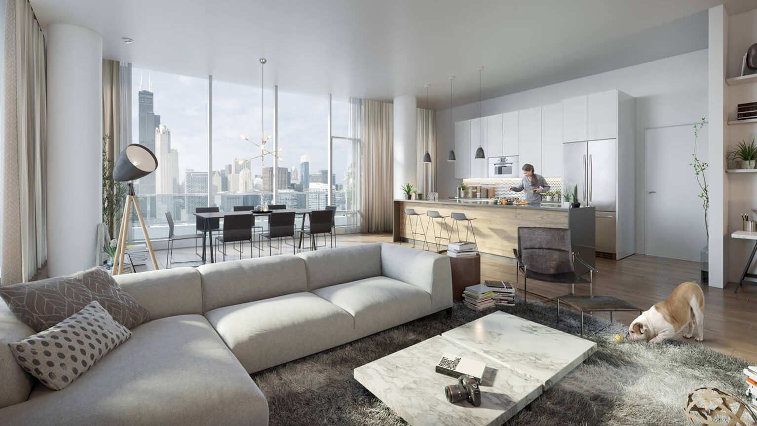 Luxurious penthouse living room with a large sectional sofa, modern kitchen, dining area, and stunning city views at The Cooper in Chicago