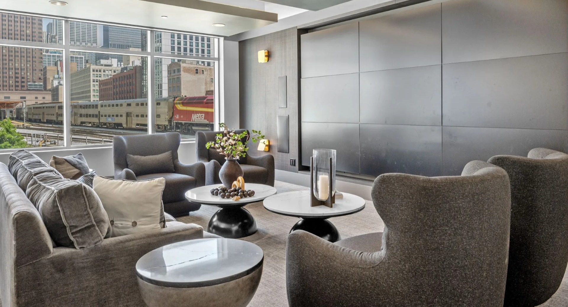 Comfortable media room with plush seating and modern decor at The Elle in Chicago