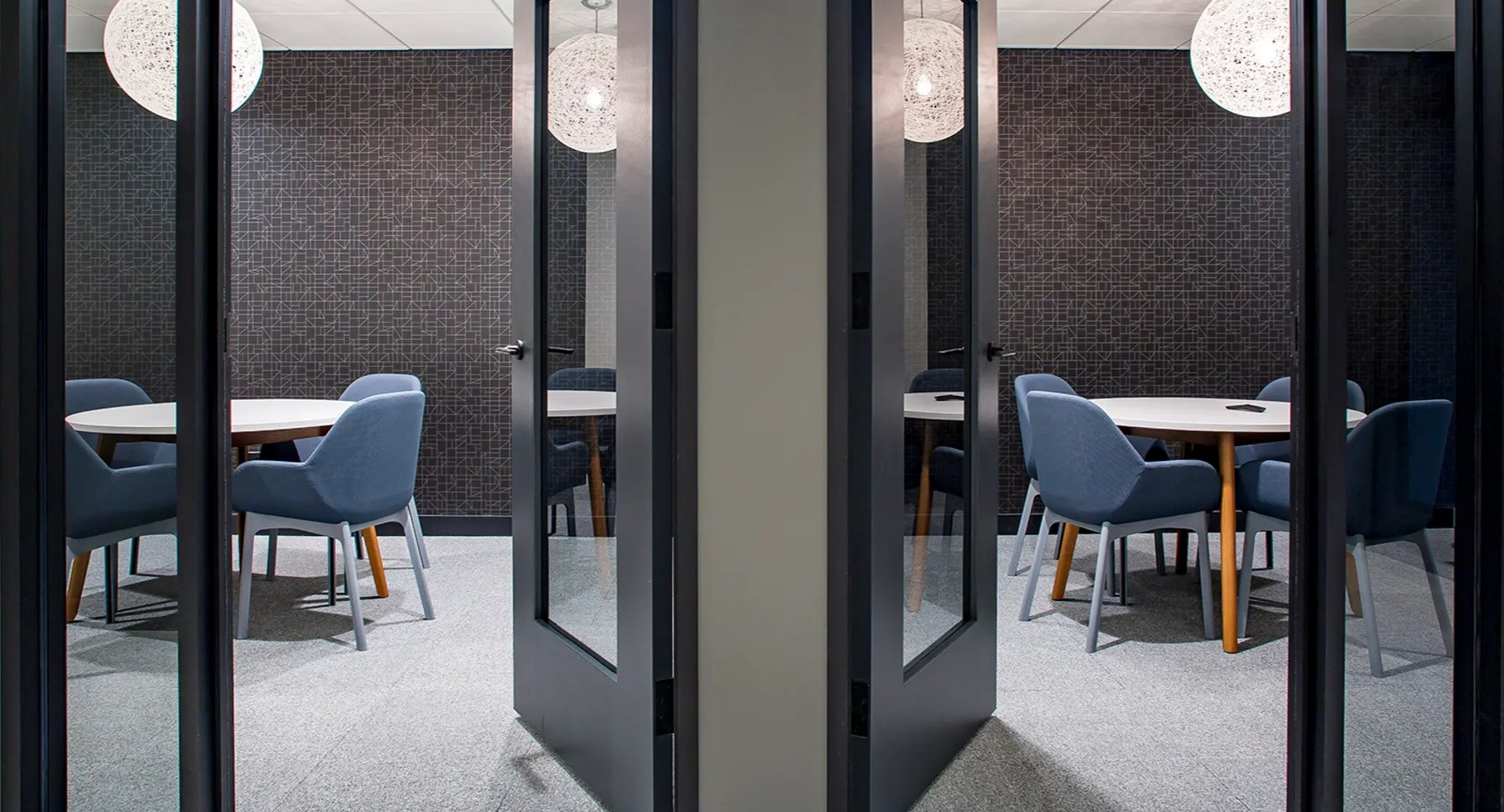 Modern private workspaces with individual tables and chairs, designed for focus and productivity at The Gallery on Wells in Chicago