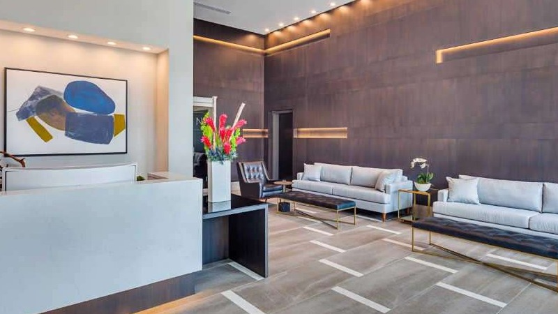 Grand lobby and lounge area at The Hudson in Chicago, featuring modern decor, comfortable seating, and a welcoming reception desk