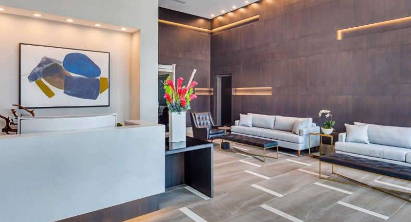 Grand lobby and lounge area at The Hudson in Chicago, featuring modern decor, comfortable seating, and a welcoming reception desk