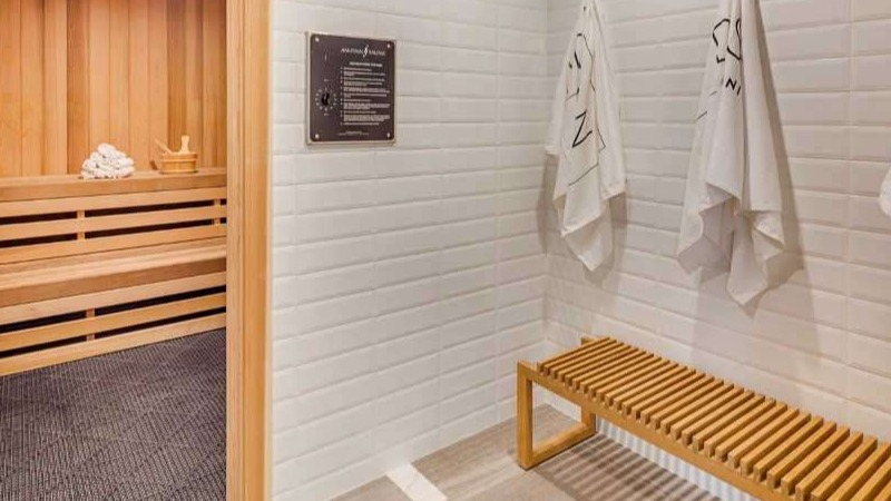 Relaxing sauna room at The Hudson in Chicago, featuring wooden benches and a serene atmosphere, perfect for unwinding