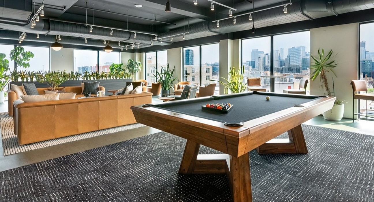 chicago-billiards-skyline	Vibrant billiards room at The Jax in Chicago, featuring a modern pool table and expansive city skyline views