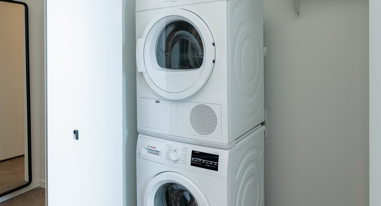 Convenient in-unit stacked washer and dryer at The Jax in Chicago, offering modern laundry solutions within your apartment