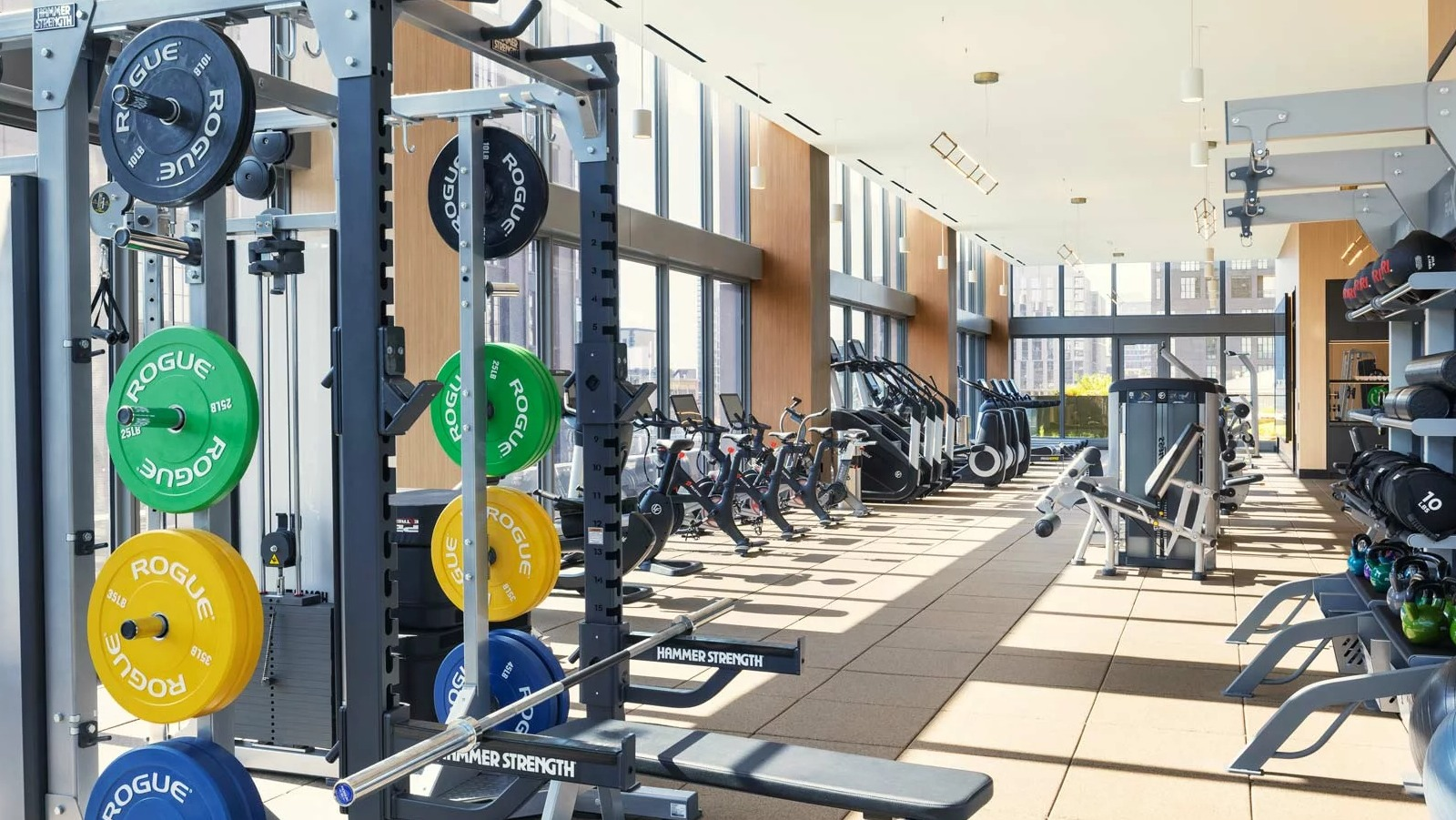 Expansive fitness center at The Row Fulton Market in Chicago, featuring a wide range of weights, machines, and cardio equipment