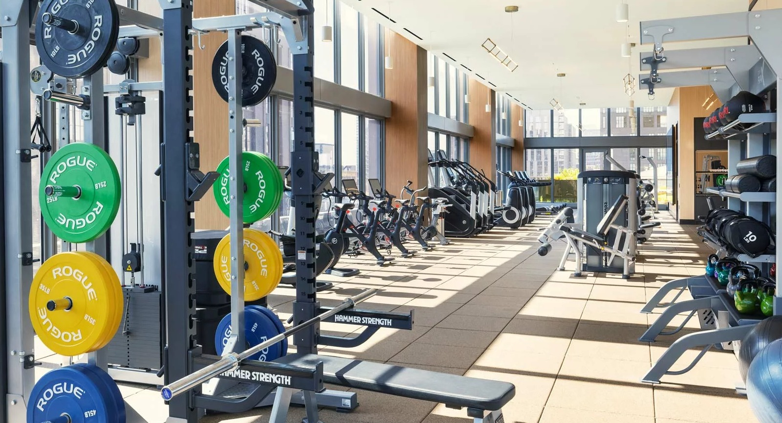 Expansive fitness center at The Row Fulton Market in Chicago, featuring a wide range of weights, machines, and cardio equipment