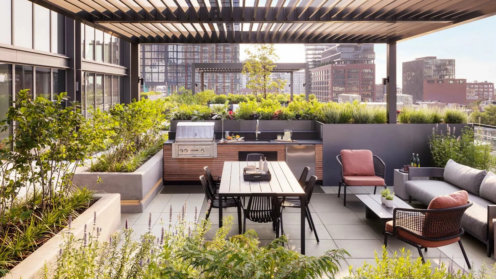 Stylish rooftop dining and grilling area at The Row Fulton Market in Chicago, featuring modern pergolas, BBQs, and lush landscaping