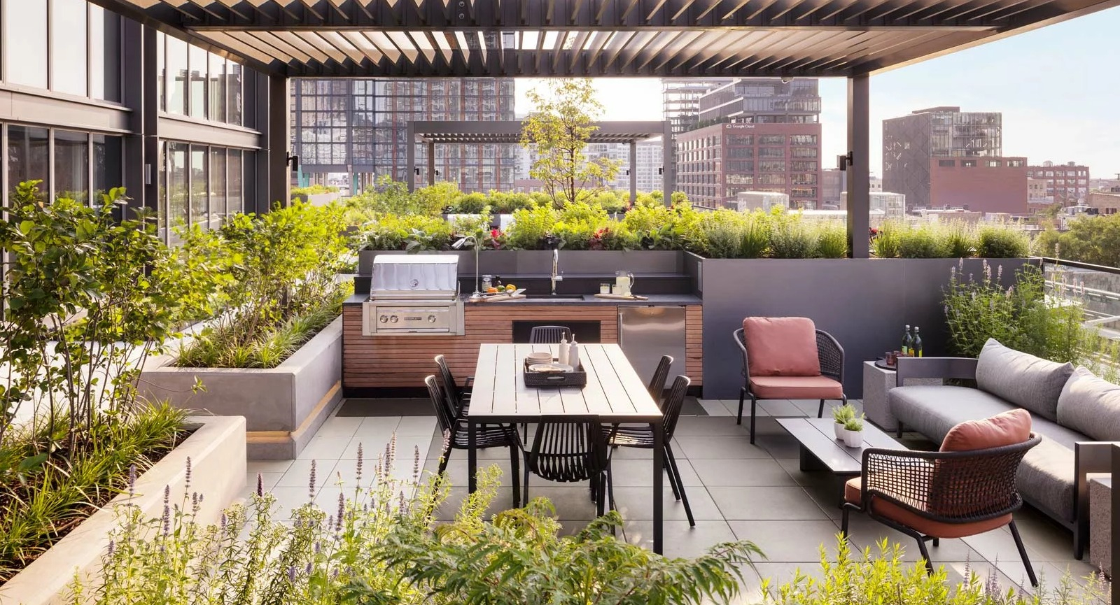 Stylish rooftop dining and grilling area at The Row Fulton Market in Chicago, featuring modern pergolas, BBQs, and lush landscaping