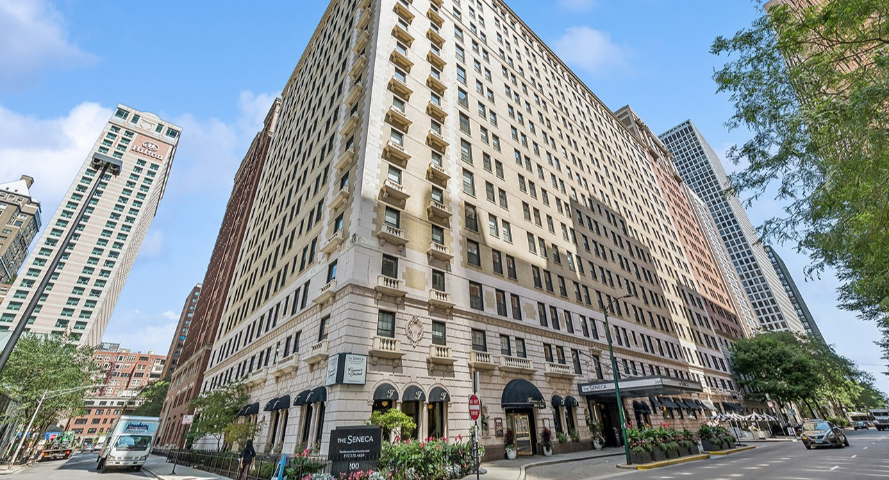 Historic exterior of The Seneca Apartments in Chicago, showcasing its classic architecture and prominent street corner location
