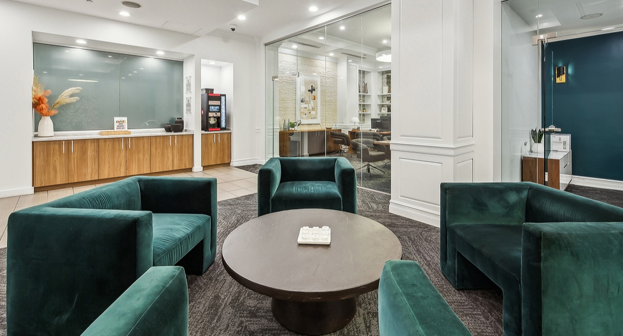 Elegant lounge area at The Seneca Apartments in Chicago, featuring plush seating, a coffee bar, and private co-working spaces