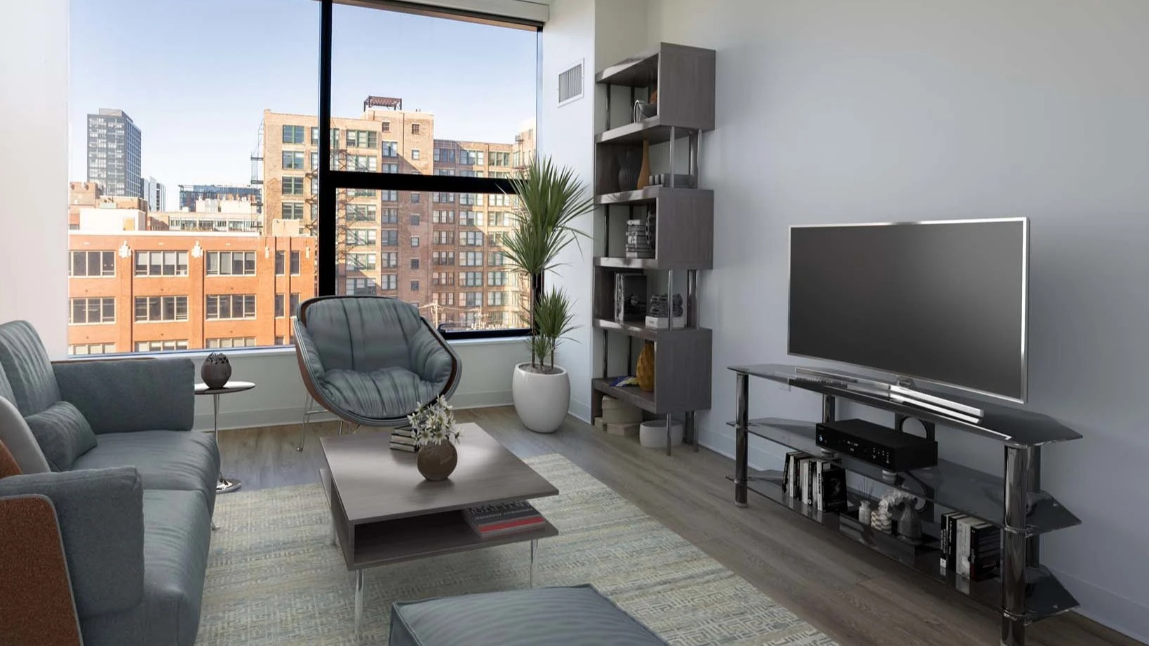 Modern living room at The Van Buren apartments with a comfortable sofa, stylish furniture, and large windows overlooking Chicago