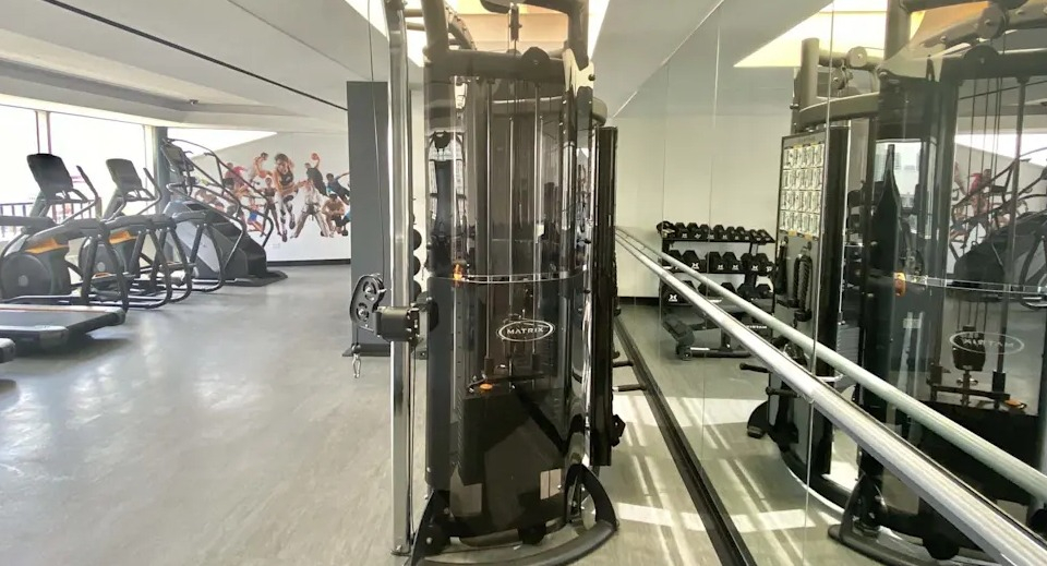 Modern fitness center with functional training equipment, cable machines, and free weights, perfect for diverse workouts at Two East Oak in Chicago