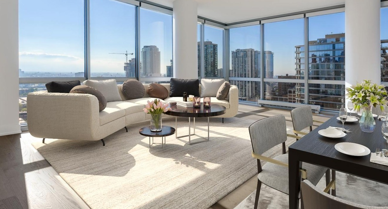 Spacious apartment interior with light-filled rooms, contemporary furnishings, and panoramic city views at Two West in Chicago