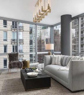 Elegant dining area with a sleek table and modern chairs, perfect for entertaining at Two West in Chicago.