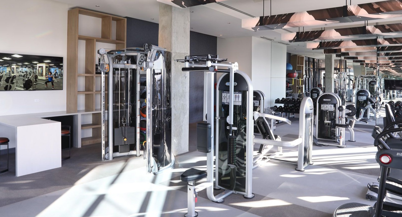 State-of-the-art fitness center with a wide range of exercise machines and ample space at Union West apartments in Chicago