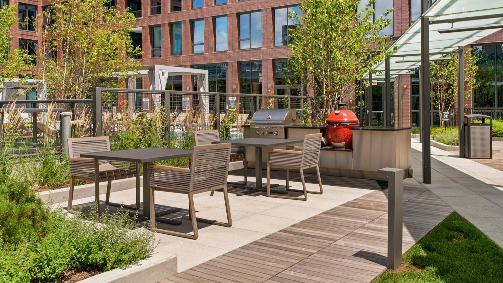 Beautiful outdoor patio with grilling stations and dining tables, perfect for entertaining at Union West apartments in Chicago