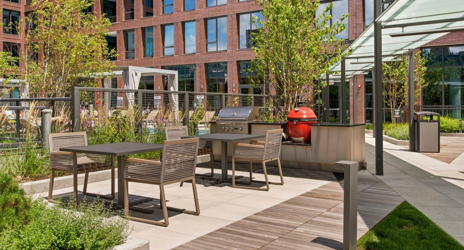 Beautiful outdoor patio with grilling stations and dining tables, perfect for entertaining at Union West apartments in Chicago