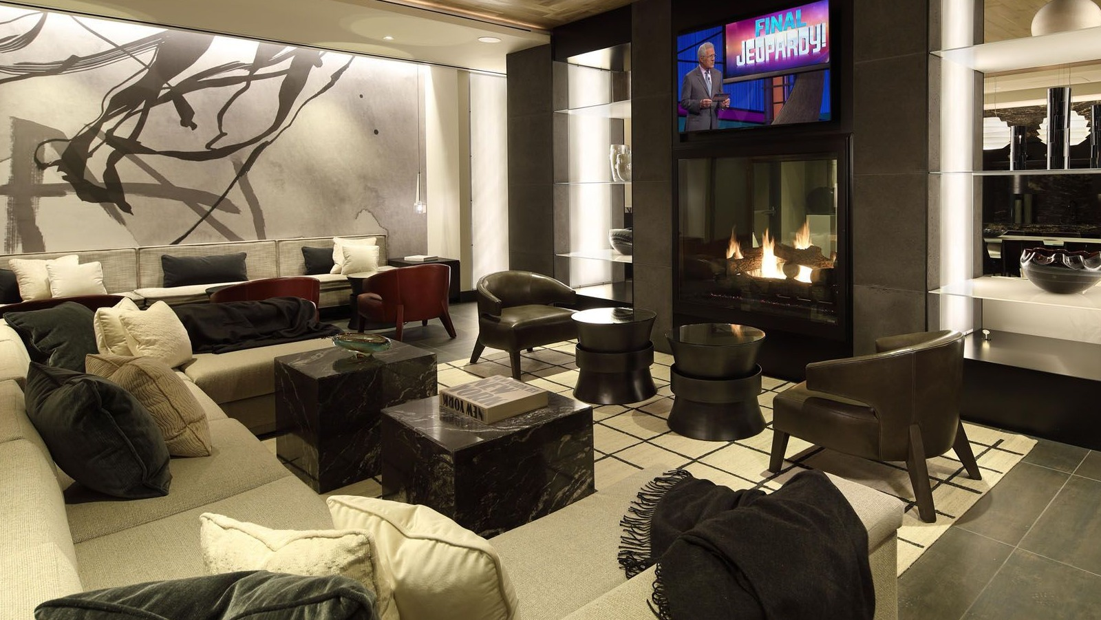 Stylish resident lounge with a large fireplace, comfortable seating, and modern decor, creating a cozy atmosphere at Union West, Chicago