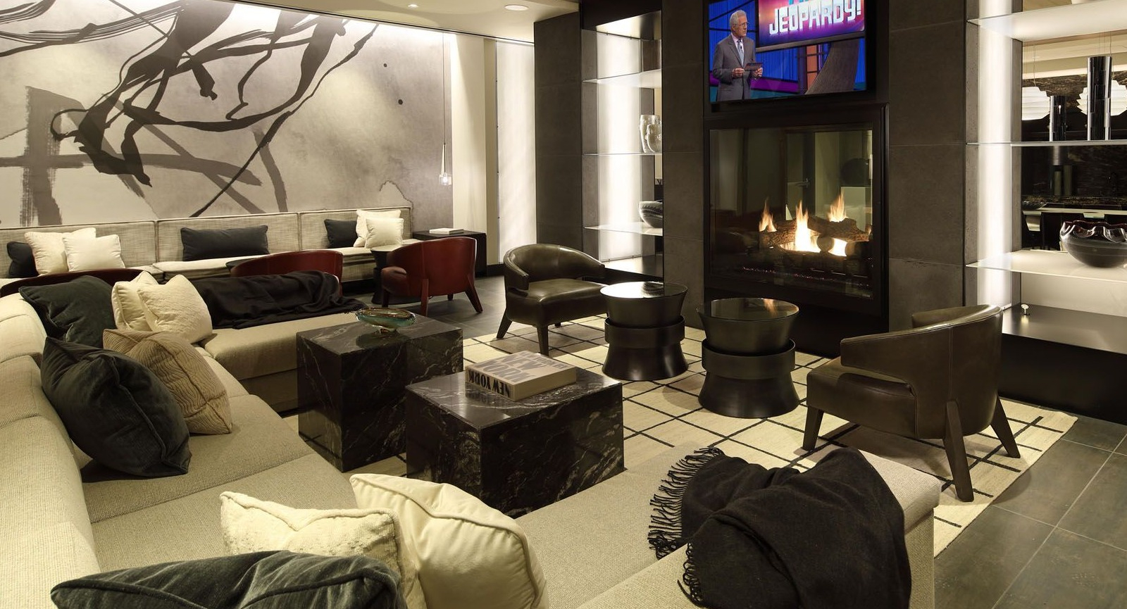 Stylish resident lounge with a large fireplace, comfortable seating, and modern decor, creating a cozy atmosphere at Union West, Chicago