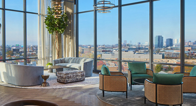 Luxurious sky lounge with plush seating, modern lighting, and panoramic city views through floor-to-ceiling windows at Westerly, Chicago