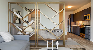 Modern studio apartment showcasing an open layout with a living area, bedroom space, and a sleek kitchen at Westerly, Chicago