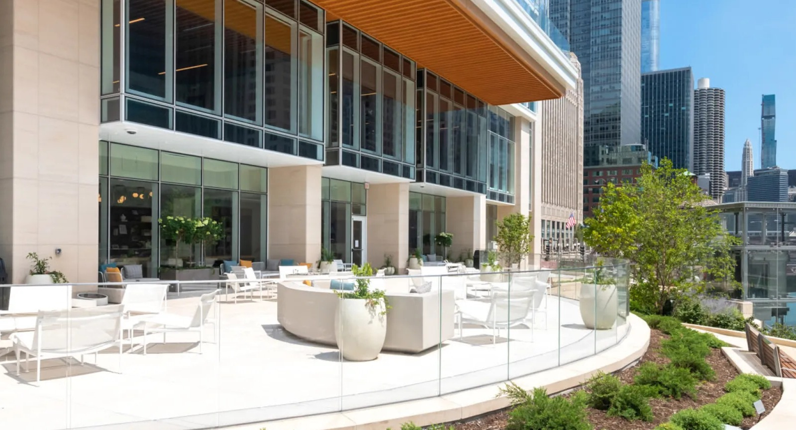 Stunning outdoor patio with comfortable seating and scenic river and city skyline views at Wolf Point East in Chicago